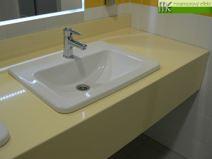 The Park of Science and Technology in Ostrava_blue and yellow countertops with rectangular holes for  integrated ceramic washbasins